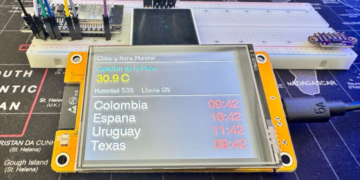 ESP32 on a breadboard driving a TFT display with a live weather and world-clock app